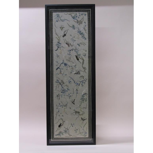 221 - A Japanese Meiji period silkwork panel, embroidered with butterflies and cats amongst blossom, frame... 