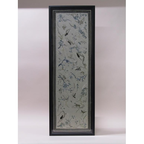 221 - A Japanese Meiji period silkwork panel, embroidered with butterflies and cats amongst blossom, frame... 