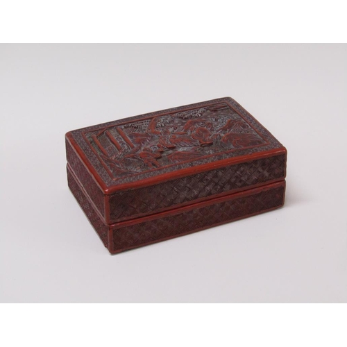 56 - A 19c Chinese cinnabar box, the lift off cover decorated in relief with figures outside a temple, 15... 