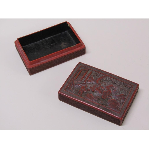 56 - A 19c Chinese cinnabar box, the lift off cover decorated in relief with figures outside a temple, 15... 