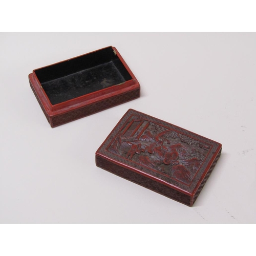 56 - A 19c Chinese cinnabar box, the lift off cover decorated in relief with figures outside a temple, 15... 