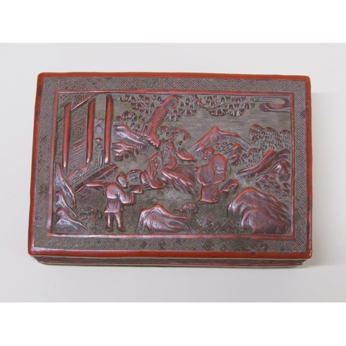 56 - A 19c Chinese cinnabar box, the lift off cover decorated in relief with figures outside a temple, 15... 