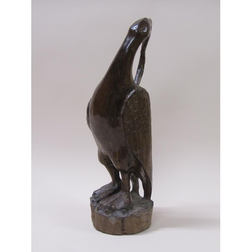 60 - An Umtswili-Leadwood carving of a bird by Lennon Musole, 45cm h.