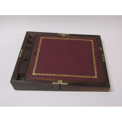 61 - A 19c rosewood writing slope with a fitted interior, leather lined slope over two wells, the hinged ... 