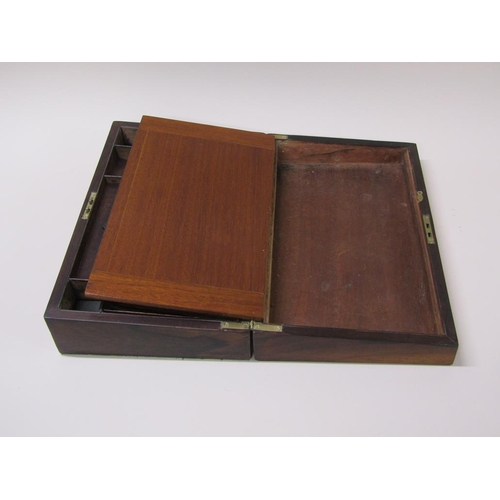 61 - A 19c rosewood writing slope with a fitted interior, leather lined slope over two wells, the hinged ... 