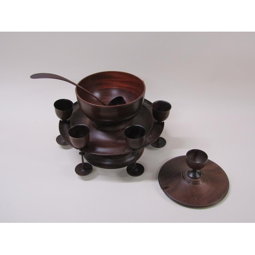 64 - A turned fruit wood wassail bowl on stand with cover, ladle and spice pot, the dished stand carrying... 