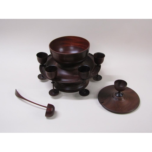 64 - A turned fruit wood wassail bowl on stand with cover, ladle and spice pot, the dished stand carrying... 