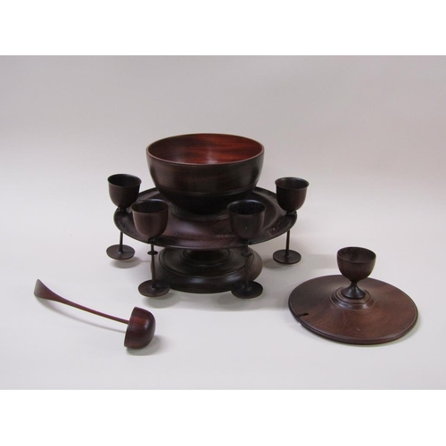 64 - A turned fruit wood wassail bowl on stand with cover, ladle and spice pot, the dished stand carrying... 