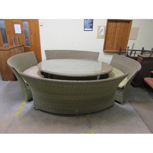 1012 - BRAMBLE CREST RATTAN GARDEN SUITE COMPRISING LARGE TABLE AND CURVED BENCH SEATING