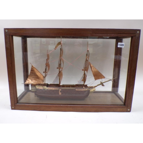 1305 - WOODEN COPPER ANODISED MODEL OF A THREE MAST SAILING VESSEL IN CASE, 55CM L