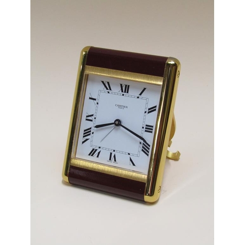 1494 - CARTIER TRAVEL ALARM CLOCK IN A FITTED BOX WITH GUARANTEE CARD, CLOCK IS NUMBERED 750500990