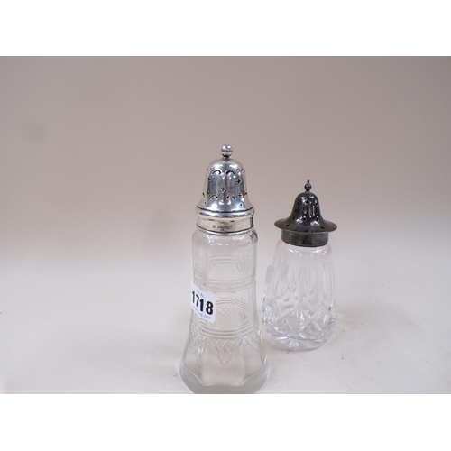 1718 - SILVER TOP CUT GLASS SHAKER AND A SILVER PLATED CUT GLASS SHAKER