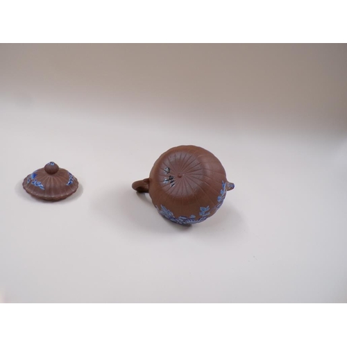 1803 - ORIENTAL TERRACOTTA TEAPOT WITH ENAMEL BLUE DECORATION,  A/F, 13CM H