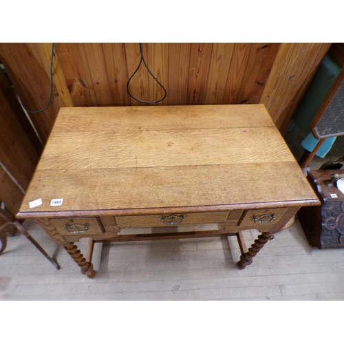 1885 - OAK SIDE TABLE FITTED ONE CENTRAL DRAWER FLANKED BY TWO SHORT DRAWERS, 92CM W, 73CM H