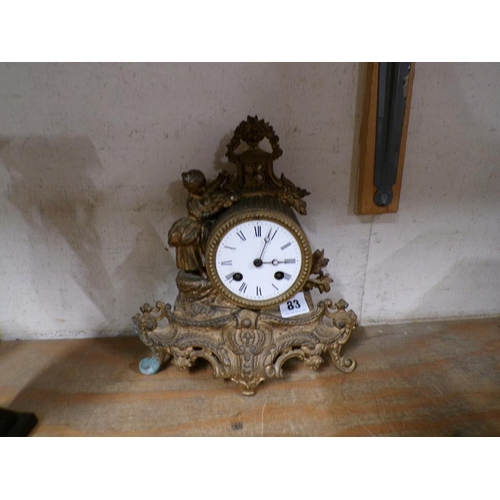 83 - FRENCH GILT METAL MANTEL CLOCK WITH ENAMEL DIAL