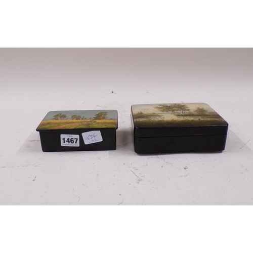 1467 - TWO RUSSIAN BLACK LACQUERED HAND PAINTED BOXES - LARGEST 15CM W