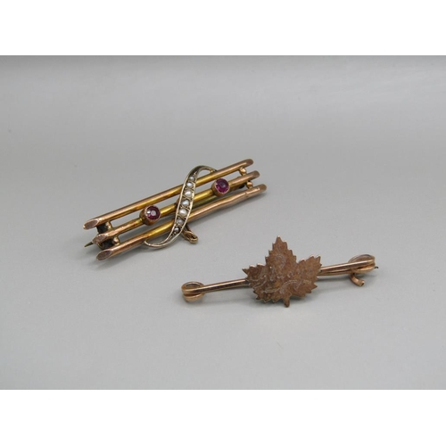 1545 - 9ct GOLD SEED PEARL SET BAR BROOCH AND A MAPLE LEAF BROOCH