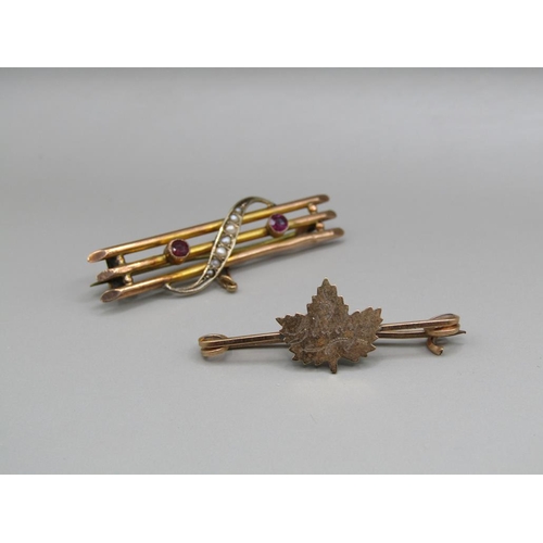 1545 - 9ct GOLD SEED PEARL SET BAR BROOCH AND A MAPLE LEAF BROOCH