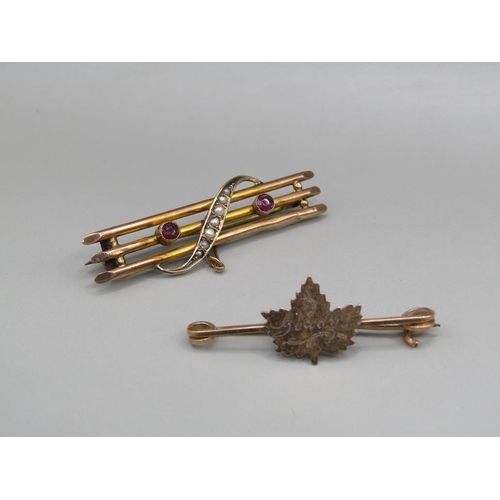 1545 - 9ct GOLD SEED PEARL SET BAR BROOCH AND A MAPLE LEAF BROOCH