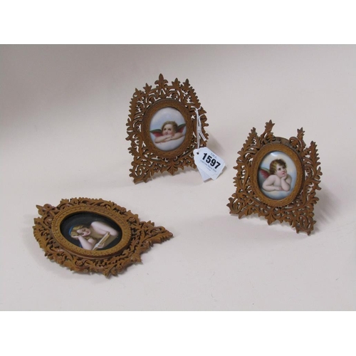 1597 - THREE 19c OVAL PORCELAIN PLAQUES OF CHERUBS AND LADIES IN FRET CARVED WOODEN FRAMES