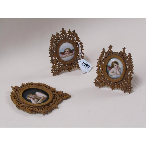 1597 - THREE 19c OVAL PORCELAIN PLAQUES OF CHERUBS AND LADIES IN FRET CARVED WOODEN FRAMES