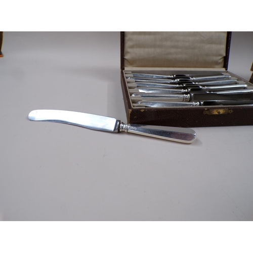 1635 - BOXED SET OF 12 SILVER HANDLED BUTTER KNIVES AND A BOX OF MIXED SILVER PLATED KNIVES