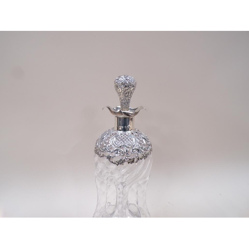 1645 - SILVER CASED DECANTER AND STOPPER (A/F) SECTION OF GLASS MISSING