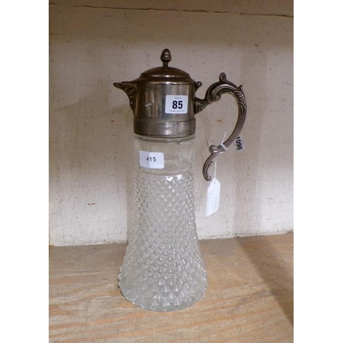 85 - MOULDED GLASS AND SILVER PLATED CLARET JUG