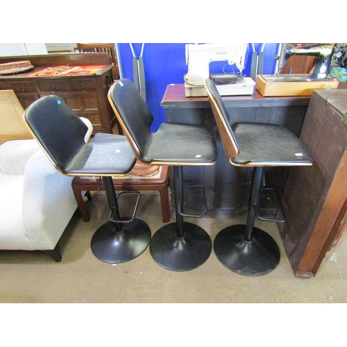 635 - THREE SWIVEL BAR STOOLS