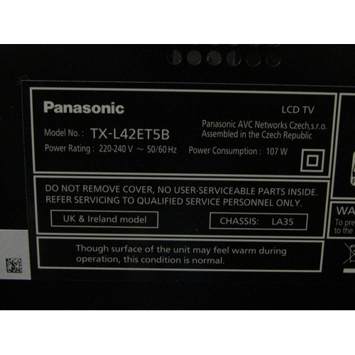 671 - PANASONIC TV AND STAG CABINET