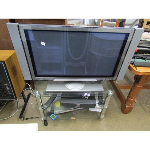 673 - TV,  GLASS STAND AND ACCESSORIES