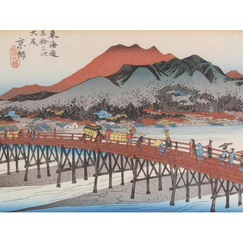 1288 - FRAMED COLOURED PRINT - JAPANESE SAMURAI; COLOURED PRINT OF TRAVELLERS ON A BRIDGE