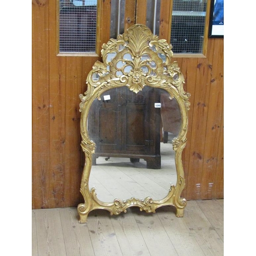 1240 - GILT CARVED AND MOULDED STUCCO WALL MIRROR, 108CM X 60CM