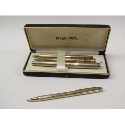 1669 - DUPONT LIGHTER AND BUTANE GAS REFILL, WHITE METAL BOTTLE SHAPED LIGHTER, THREE GILT METAL PENS