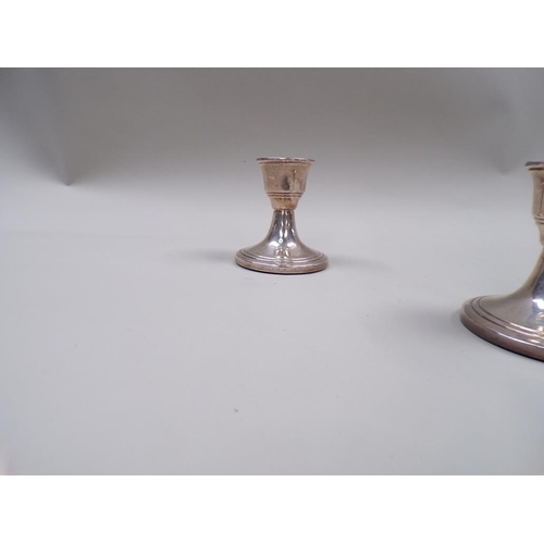 1690 - PAIR OF SILVER CASED SQUAT CANDLESTICKS