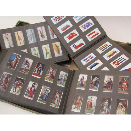 1750 - FOUR ALBUMS OF CIGARETTE CARDS