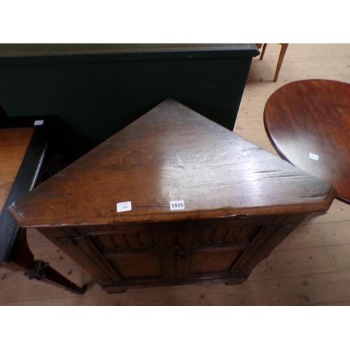 1926 - OAK CORNER CUPBOARD ENCLOSED BY TWO PANELLED DOORS 77 x 83cms