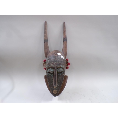 1427 - AFRICAN CARVED WOOD MASK WITH HORNS 75cms H