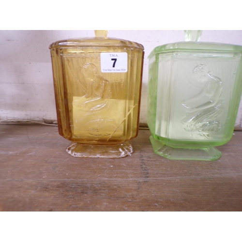 7 - TWO MOULDED GLASS DRESSING TABLE JARS AND COVERS