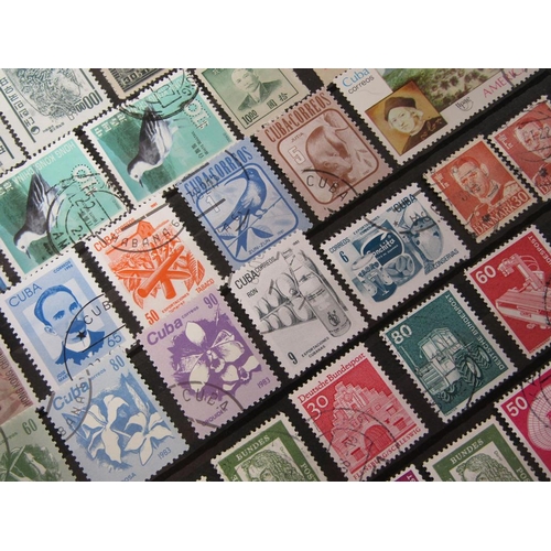 1650 - ALBUM OF MIXED STAMPS AND FRAMED SET OF FOUR STAMPS