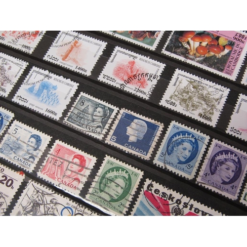 1650 - ALBUM OF MIXED STAMPS AND FRAMED SET OF FOUR STAMPS