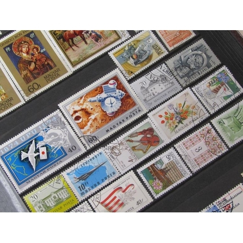 1650 - ALBUM OF MIXED STAMPS AND FRAMED SET OF FOUR STAMPS