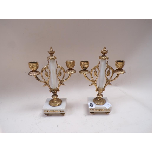 1450 - PAIR OF ALABASTER AND GILT METAL CLOCK GARNITURE CANDLESTANDS, EACH 24cms H