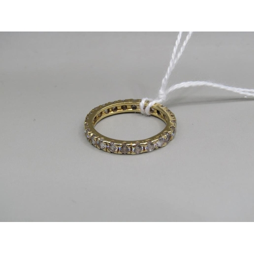 1546 - 18ct GOLD STONE SET ETERNITY RING - SIZE O 1/2