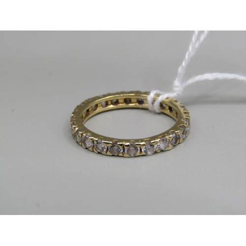 1546 - 18ct GOLD STONE SET ETERNITY RING - SIZE O 1/2