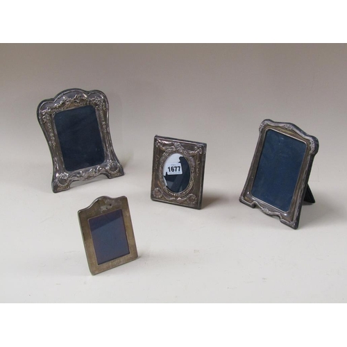 1677 - FOUR SILVER FRAMED PHOTOFRAMES