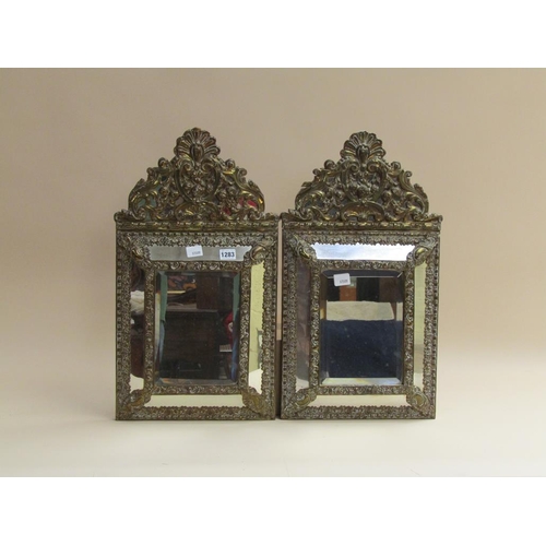1283 - PAIR OF LATE 19C/EARLY 20C EMBOSSED BRASS PANEL WALL MIRRORS, EACH 60CM X 34CM