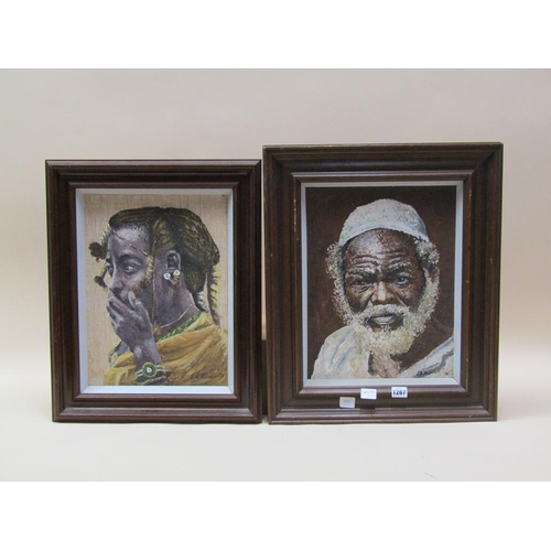 1267 - J.S MUNNOLLI - TWO AFRICAN FACES, SIGNED, EACH FRAMED APPROX 40CM X 30CM