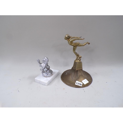 1376 - CHROMIUM LION RADIATOR MASCOT; GILT METAL FIGURE OF FLYING LADY