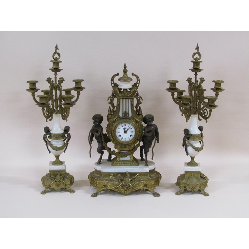 8 - A mid 20c Italian garniture de cheminée consisting of a clock and two six branch candelabra.  The fi... 